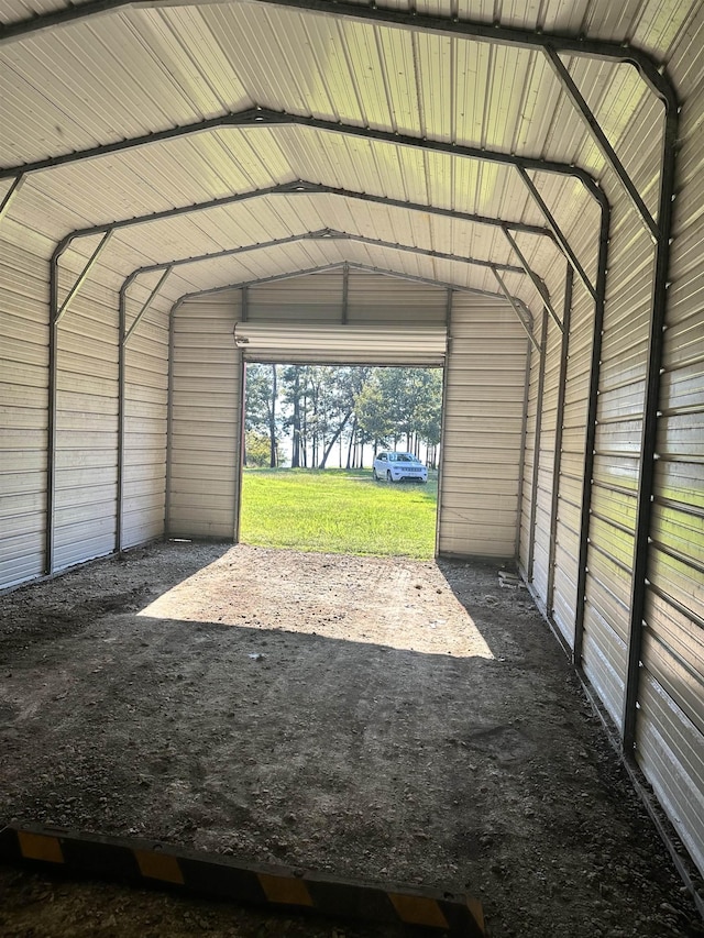 garage featuring a carport