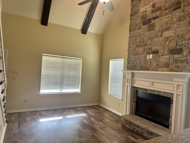 unfurnished living room with beamed ceiling, dark hardwood / wood-style floors, high vaulted ceiling, and a fireplace