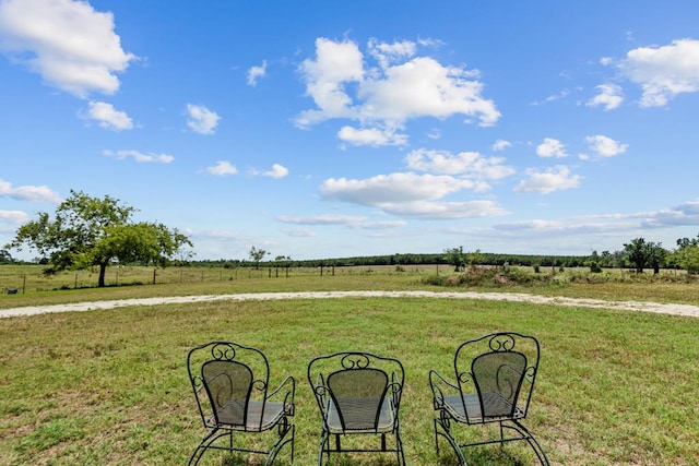 view of yard with a rural view