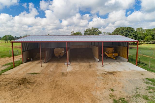 view of parking with a rural view