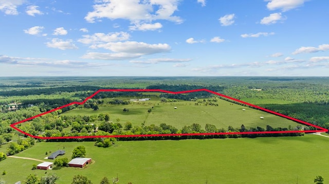 birds eye view of property with a rural view