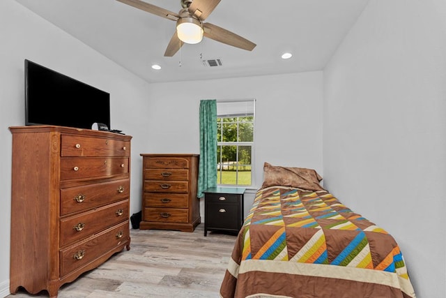 bedroom with ceiling fan and light wood-type flooring