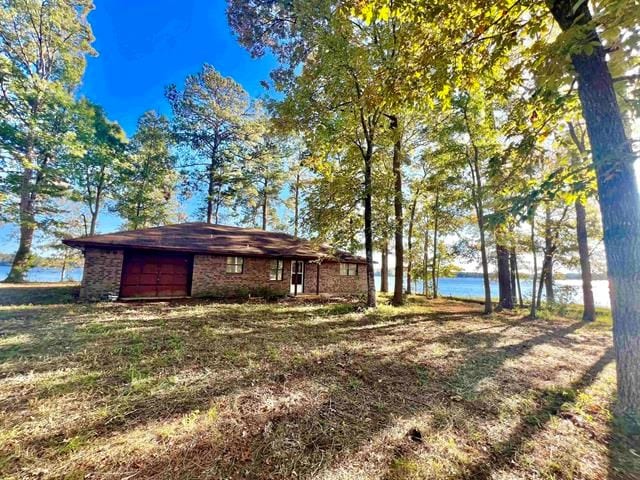 122 Isle Dr, Hemphill, TX 75948 - view of yard featuring a water view and a garage