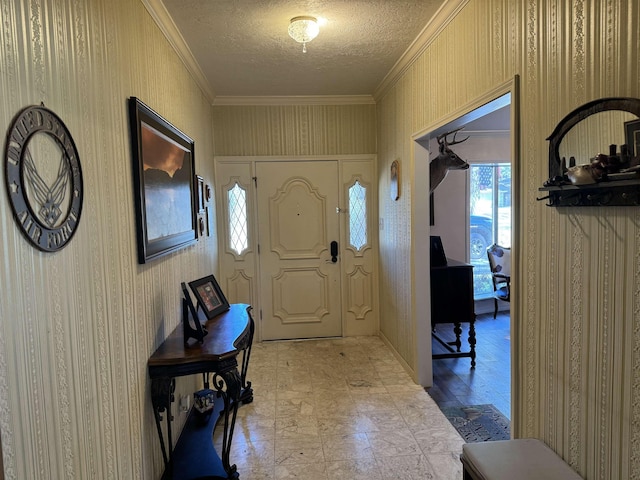 entryway featuring crown molding and a textured ceiling