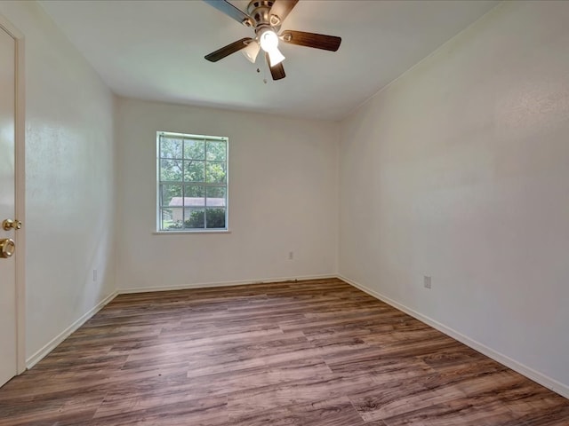 1313 Glass Ave, Diboll, TX 75941 - empty room with ceiling fan and wood finished floors