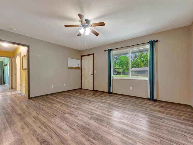 1313 Glass Ave, Diboll, TX 75941 - unfurnished room featuring a ceiling fan, light wood-style floors, and a smoke detector