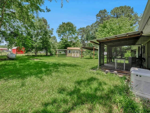1313 Glass Ave, Diboll, TX 75941 - view of green lawn with a storage unit and a deck