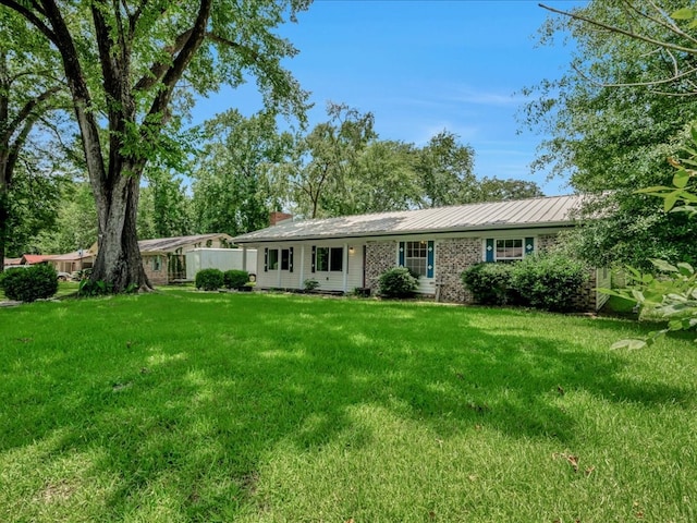 1313 Glass Ave, Diboll, TX 75941 - single story home with a front yard and a chimney