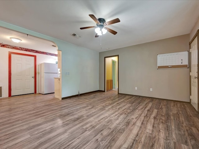 1313 Glass Ave, Diboll, TX 75941 - empty room with a ceiling fan and wood finished floors