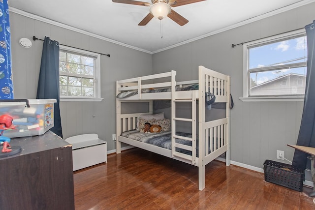 bedroom featuring ceiling fan, dark hardwood / wood-style flooring, and ornamental molding