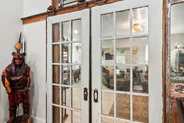 room details featuring a barn door and french doors