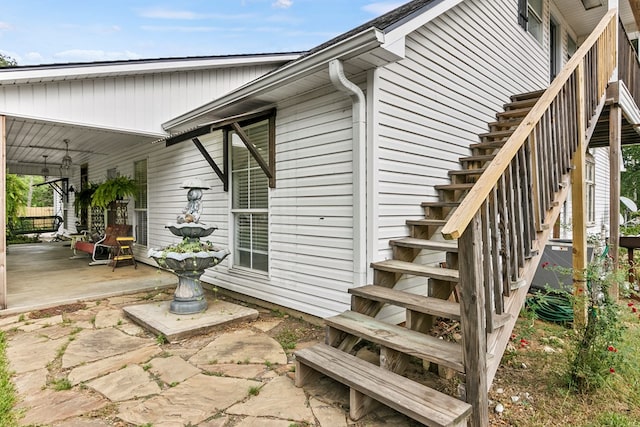 view of side of property with a patio area