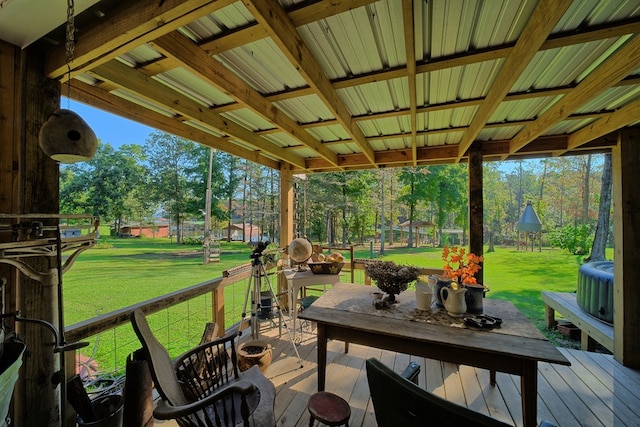 wooden terrace featuring a yard