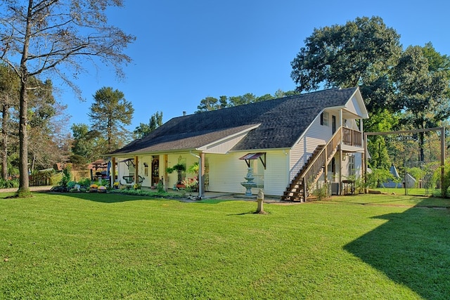 exterior space with central AC and a lawn