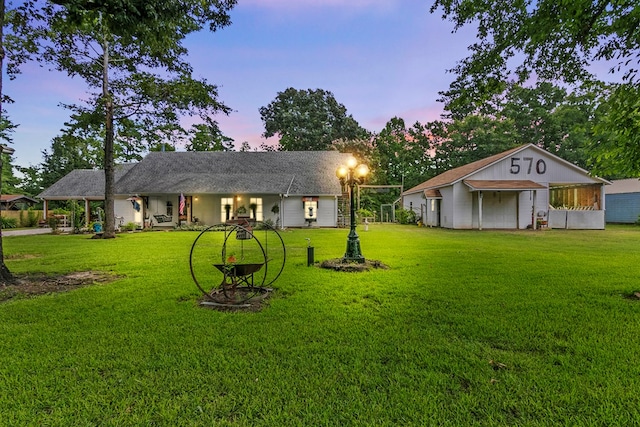 ranch-style house featuring a yard