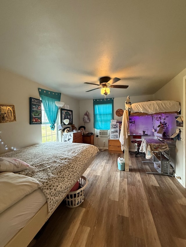 bedroom featuring hardwood / wood-style flooring and ceiling fan