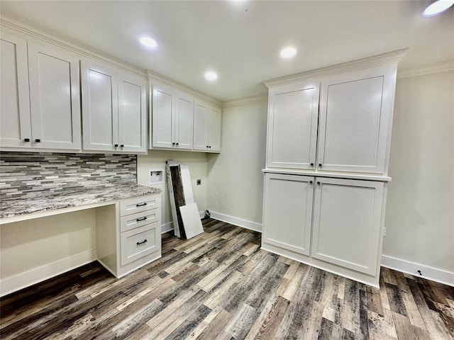 washroom with cabinets, washer hookup, hookup for an electric dryer, ornamental molding, and dark wood-type flooring