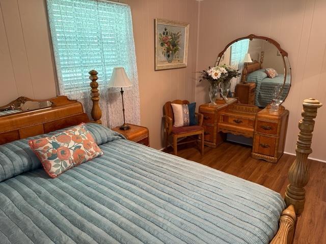 bedroom with hardwood / wood-style flooring