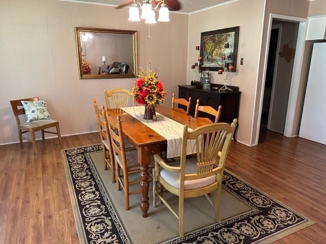 dining area with hardwood / wood-style floors, ceiling fan, and crown molding