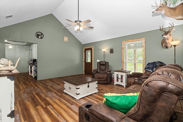 living room with dark hardwood / wood-style floors, ceiling fan, and lofted ceiling