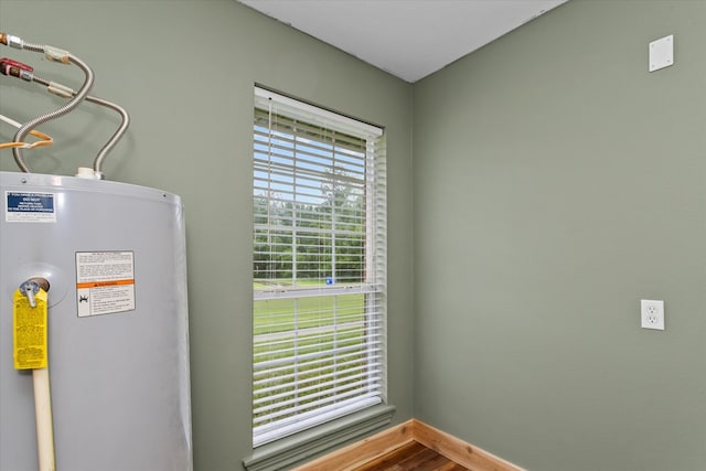 utility room featuring water heater