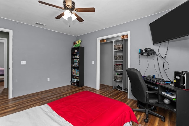 office space with ceiling fan and dark hardwood / wood-style floors