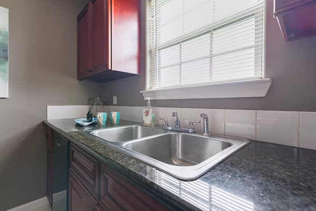 2013 Ellis School Rd, Baytown, TX 77521 - kitchen with dark brown cabinets and a sink