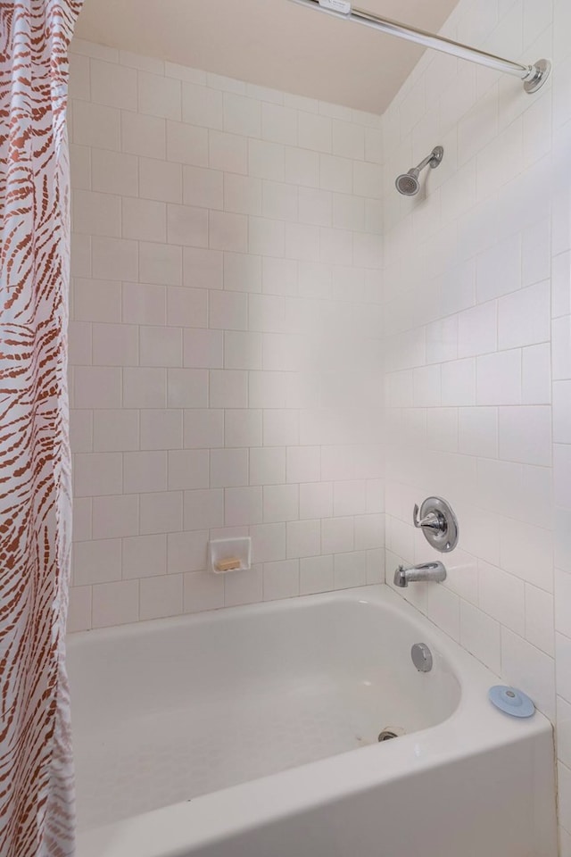 2013 Ellis School Rd, Baytown, TX 77521 - bathroom with shower / tub combo with curtain
