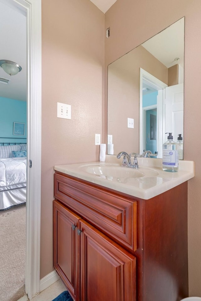 2013 Ellis School Rd, Baytown, TX 77521 - bathroom with vanity and ensuite bath
