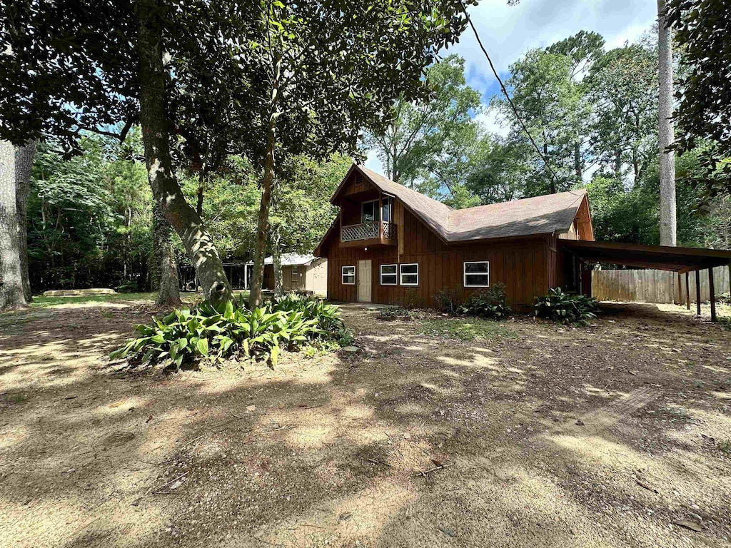 view of home's exterior featuring a carport