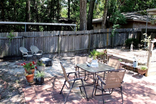 1003 Linton Lanier Ln, Jasper, TX 75951 - fenced backyard with a patio and outdoor dining area
