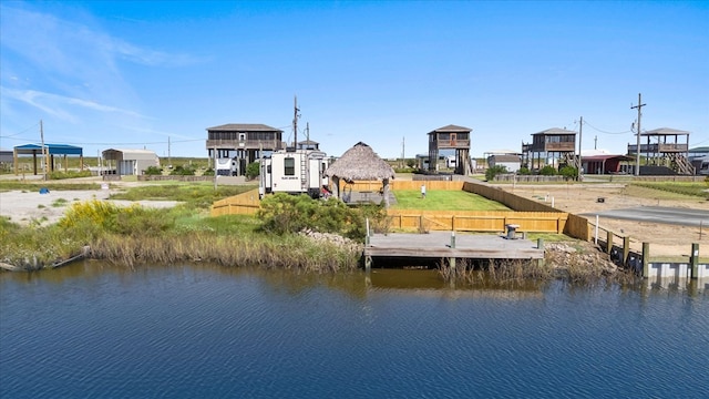 dock area with a gazebo and a water view