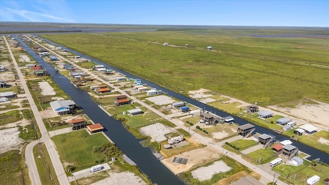 drone / aerial view with a water view and a rural view