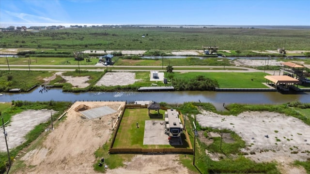 drone / aerial view featuring a water view and a rural view