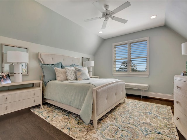 bedroom featuring ceiling fan, dark hardwood / wood-style flooring, and lofted ceiling