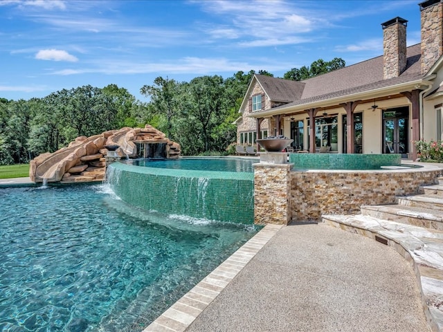 1811 Caspers Cv, Lufkin, TX 75904 - view of pool with a ceiling fan, french doors, and a pool with connected hot tub