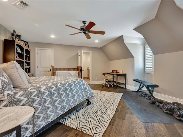 bedroom featuring dark hardwood / wood-style flooring, vaulted ceiling, and ceiling fan