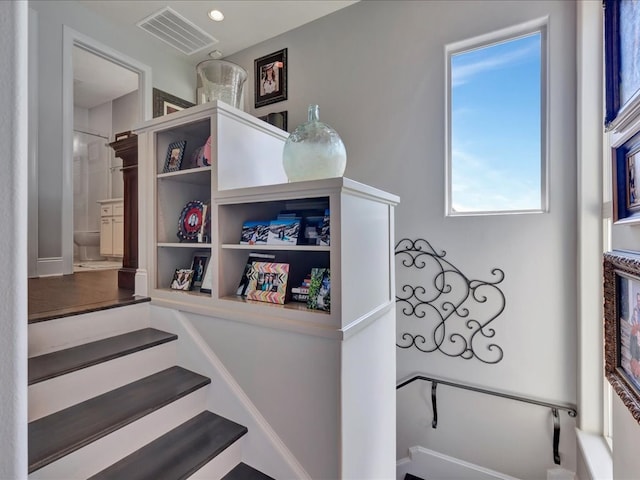 staircase featuring recessed lighting and visible vents