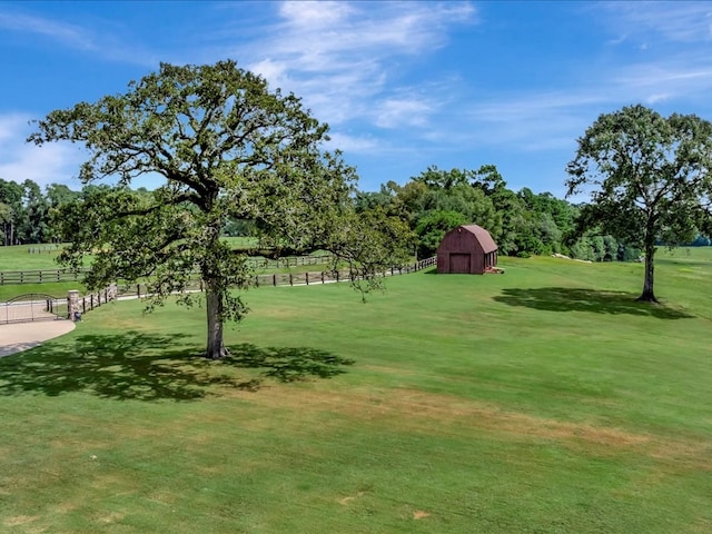 surrounding community featuring an outbuilding and a lawn