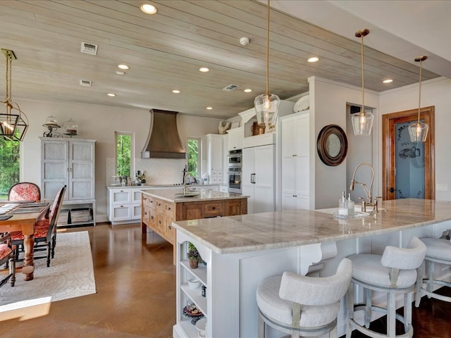 kitchen with visible vents, a large island, recessed lighting, wooden ceiling, and custom exhaust hood