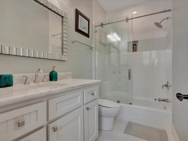 full bathroom featuring shower / bath combination with glass door, tile patterned flooring, vanity, and toilet