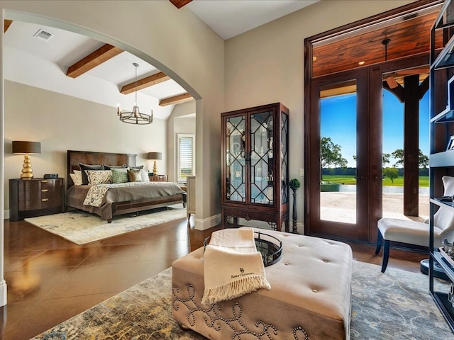 bedroom with tile patterned flooring, visible vents, arched walkways, a notable chandelier, and access to outside