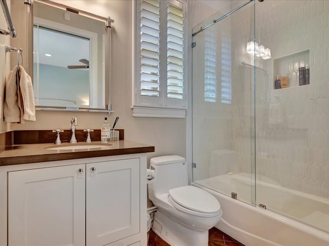 full bathroom with shower / bath combination with glass door, vanity, toilet, and tile patterned flooring