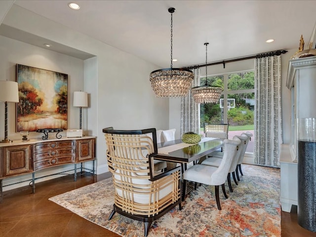 dining area featuring recessed lighting, baseboards, and an inviting chandelier