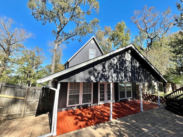 670 Cedar Crest Cir, Hemphill, TX 75948 - view of property exterior featuring french doors, a gate, a patio, and a deck