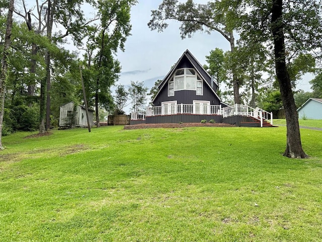 670 Cedar Crest Cir, Hemphill, TX 75948 - back of house featuring a wooden deck and a yard