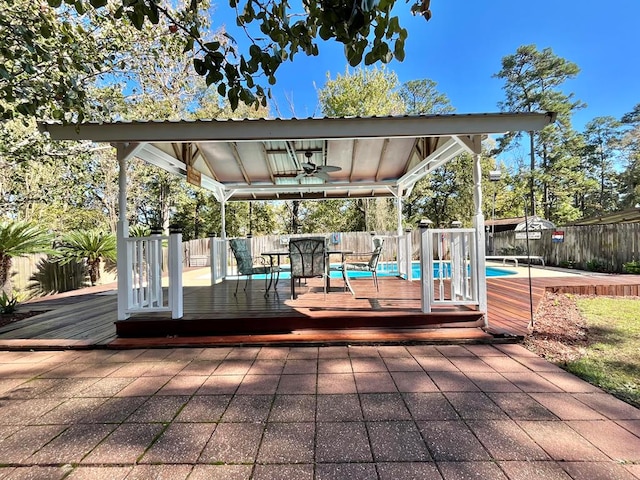 670 Cedar Crest Cir, Hemphill, TX 75948 - wooden deck featuring a ceiling fan and a fenced backyard