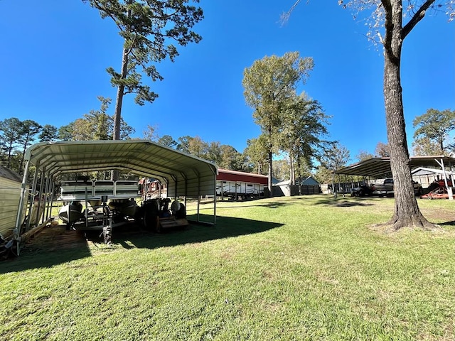 670 Cedar Crest Cir, Hemphill, TX 75948 - view of grassy yard with a detached carport