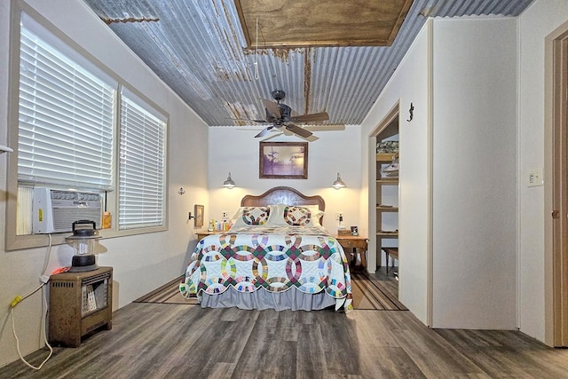 bedroom featuring wood-type flooring, ceiling fan, cooling unit, and wood ceiling