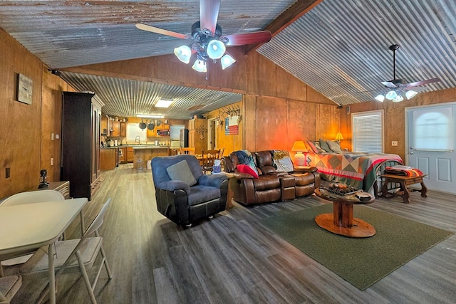 interior space with hardwood / wood-style floors, wooden walls, and beam ceiling